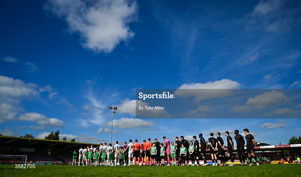 3 October 2026; Players stand for the playing of Amhrán na bhFiann before the FAI Junior Cup final between Coachford and Evergreen at Munster FA Turner's Cross Park in Cork. Photo by Tyler Miller/Sportsfile