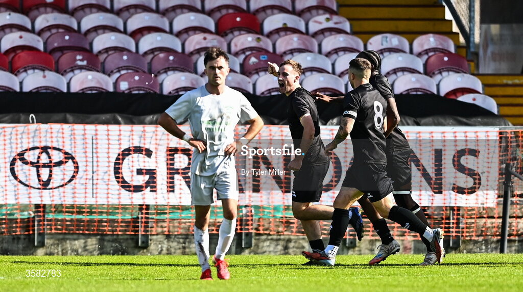 3 October 2026; Ethan Phelan of Evergreen, left, celebrates after scoring his side's first goal during the FAI Junior Cup final between Coachford and Evergreen at Munster FA Turner's Cross Park in Cork. Photo by Tyler Miller/Sportsfile
