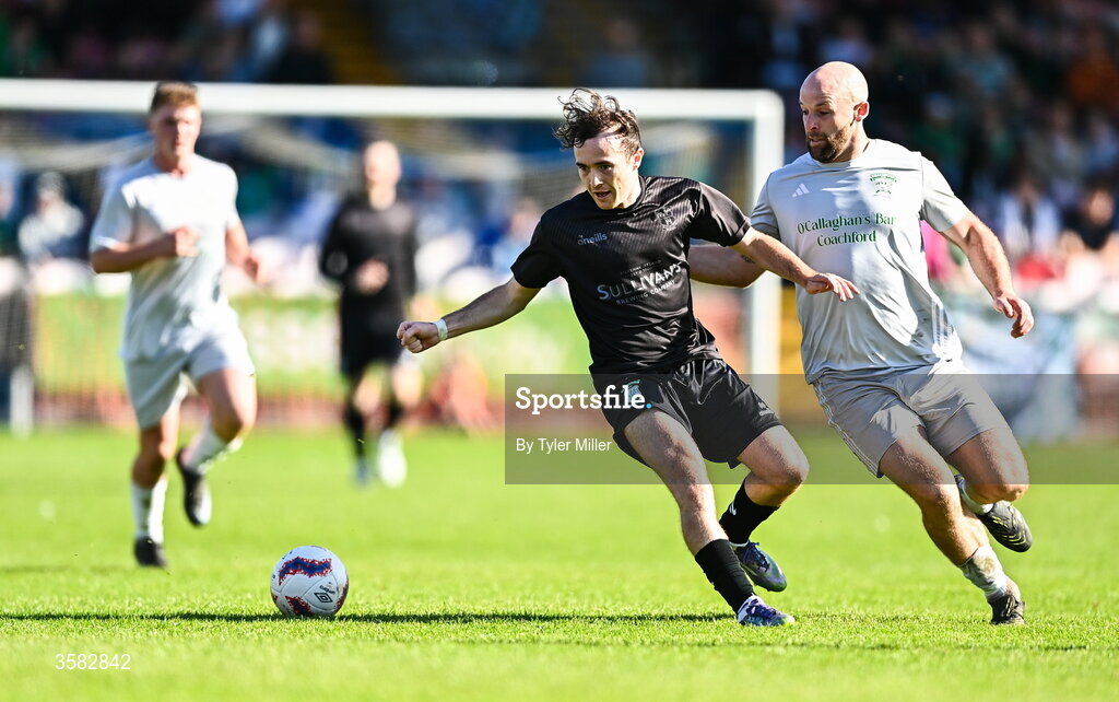 3 October 2026; Ben Hickey of Evergreen in action against Sean O'Sullivan of Coachford during the FAI Junior Cup final between Coachford and Evergreen at Munster FA Turner's Cross Park in Cork. Photo by Tyler Miller/Sportsfile