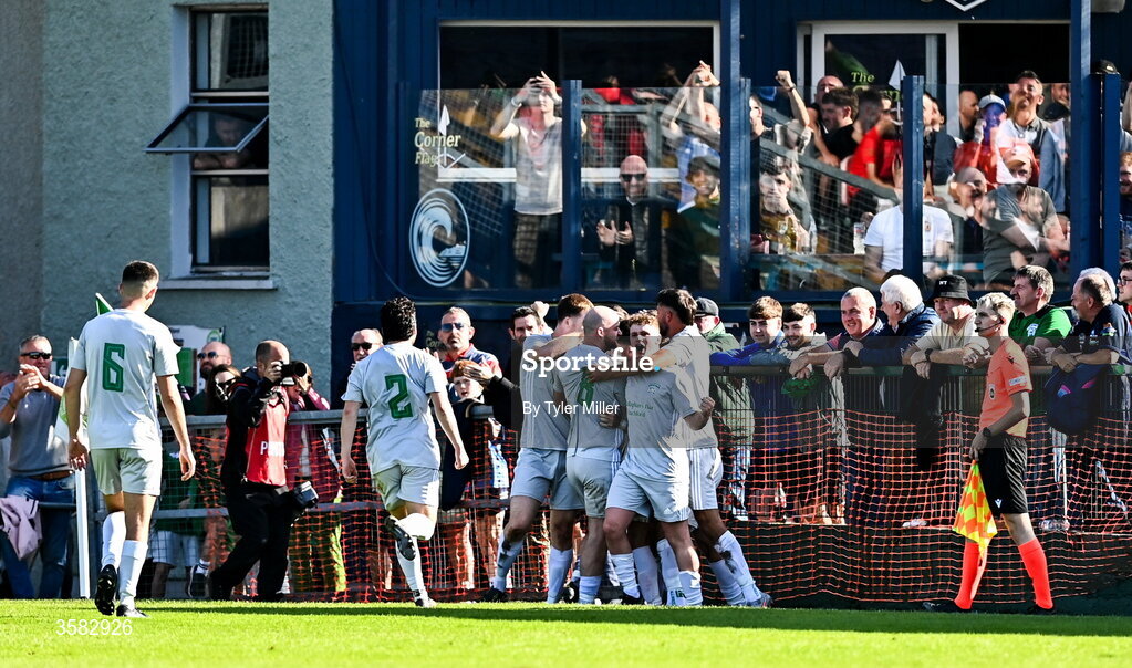 3 October 2026; Coachford players celebrate as Cialan O'Sullivan, hidden, scores their side's second goal during the FAI Junior Cup final between Coachford and Evergreen at Munster FA Turner's Cross Park in Cork. Photo by Tyler Miller/Sportsfile