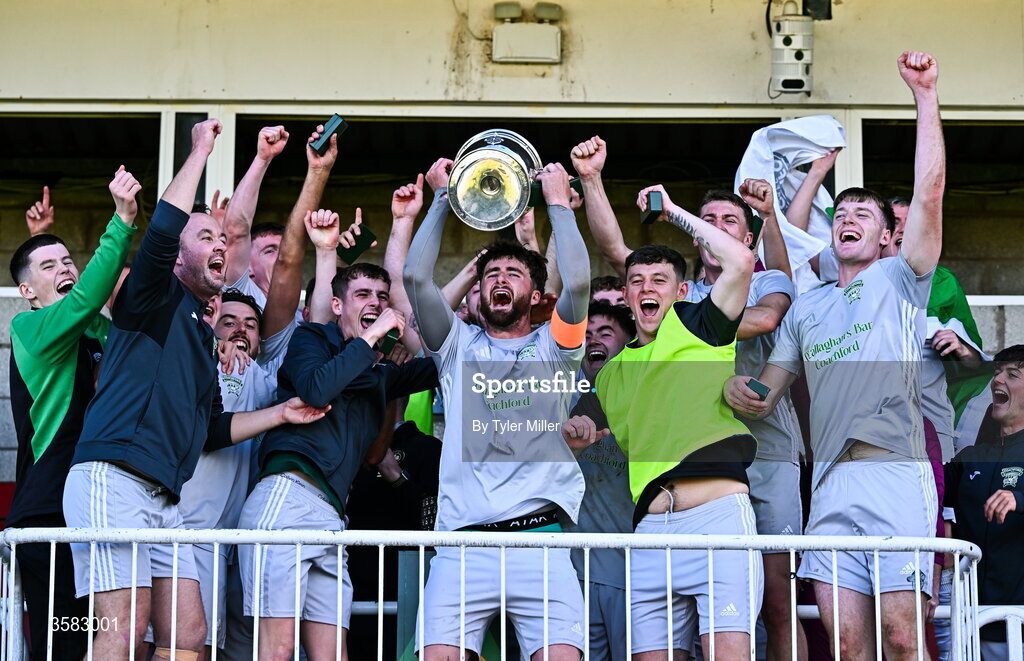 3 October 2026; Coachford captain Mark Murphy lifts the trophy alongside teammates after the FAI Junior Cup final between Coachford and Evergreen at Munster FA Turner's Cross Park in Cork. Photo by Tyler Miller/Sportsfile