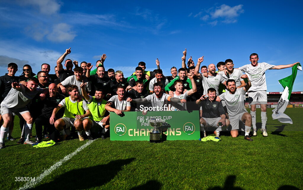 3 October 2026; Coachford players and staff celebrate with the trophy after the FAI Junior Cup final between Coachford and Evergreen at Munster FA Turner's Cross Park in Cork. Photo by Tyler Miller/Sportsfile