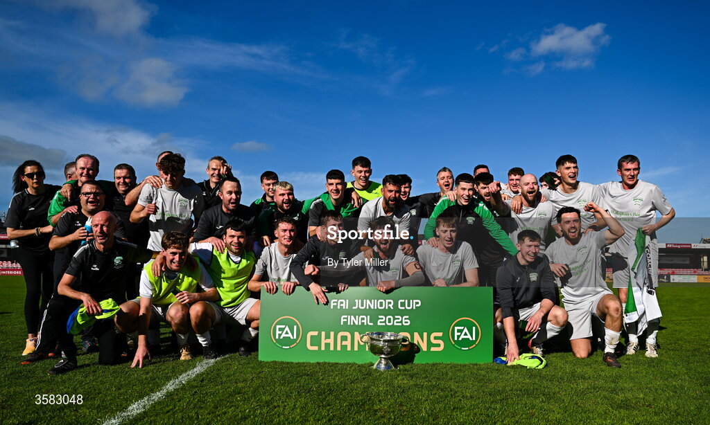 3 October 2026; Coachford players and staff celebrate with the trophy after the FAI Junior Cup final between Coachford and Evergreen at Munster FA Turner's Cross Park in Cork. Photo by Tyler Miller/Sportsfile