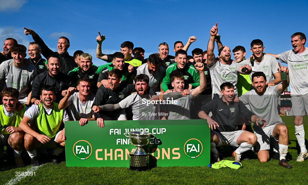 3 October 2026; Coachford players and staff celebrate with the trophy after the FAI Junior Cup final between Coachford and Evergreen at Munster FA Turner's Cross Park in Cork. Photo by Tyler Miller/Sportsfile
