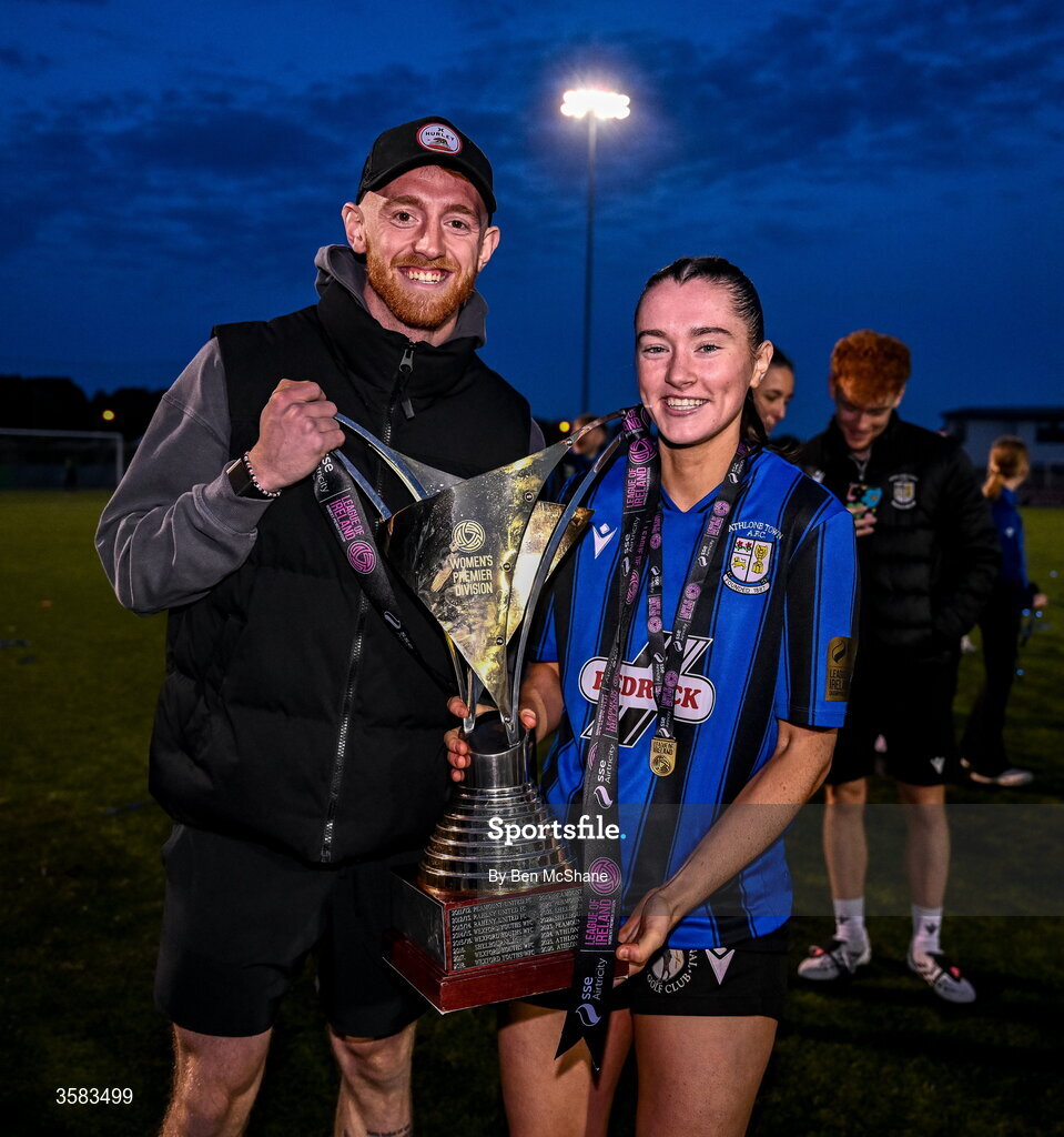 3 October 2026; Melissa O'Kane of Athlone Town celebrates with her partner, and Dundalk FC goalkeeper, Enda Minogue, and the SSE Airtricity Women's Premier Division trophy after the SSE Airtricity Women's Premier Division match between Athlone Town and Galway United at Athlone Town Stadium in Lissywollen, Athlone, Westmeath. Photo by Ben McShane/Sportsfile
