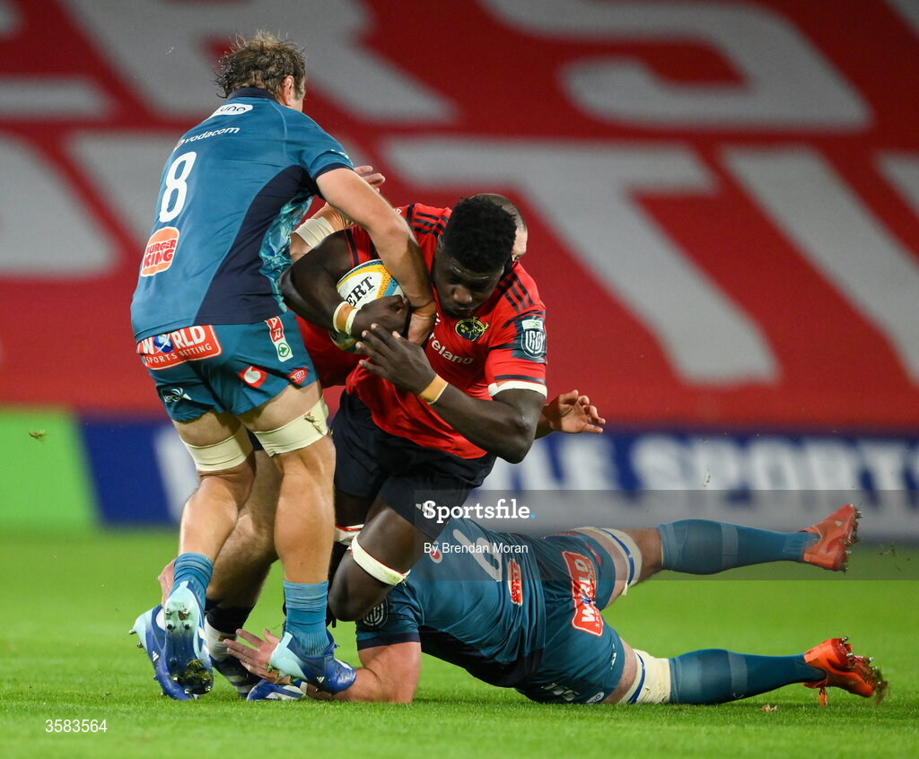 3 October 2026; Seán Edogbo of Munster is tackled by Jeandre Rudolph and Marcell Coetzee of Vodacome Bulls during the United Rugby Championship match between Munster and Vodacom Bulls at Thomond Park in Limerick. Photo by Brendan Moran/Sportsfile