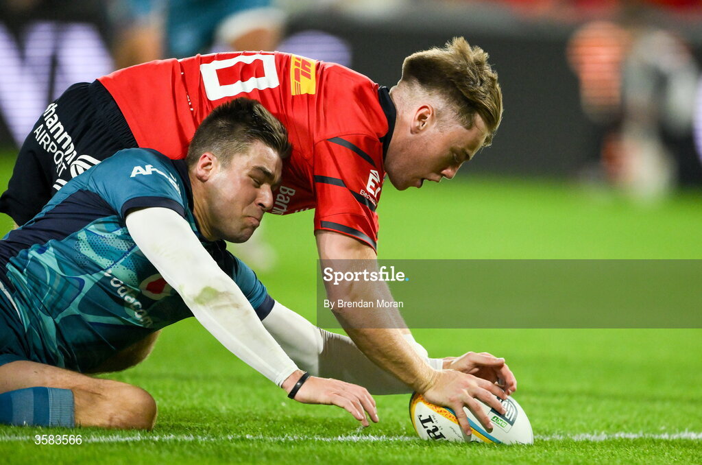 3 October 2026; Charlie O’Shea of Munster scores his side's second try despite the efforts of Zak Burger of Vodacome Bulls during the United Rugby Championship match between Munster and Vodacom Bulls at Thomond Park in Limerick. Photo by Brendan Moran/Sportsfile