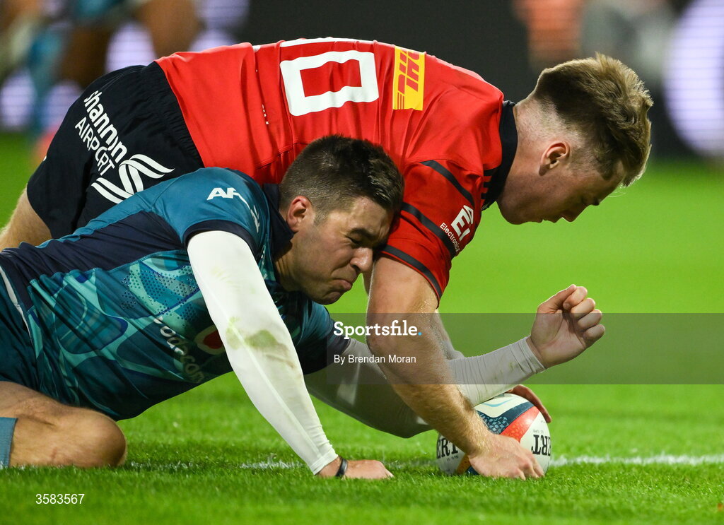 3 October 2026; Charlie O’Shea of Munster scores his side's second try despite the efforts of Zak Burger of Vodacome Bulls during the United Rugby Championship match between Munster and Vodacom Bulls at Thomond Park in Limerick. Photo by Brendan Moran/Sportsfile