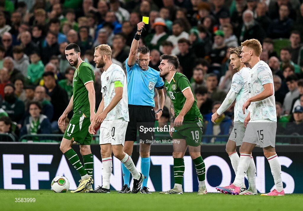 1 October 2026; Ryan Manning of Republic of Ireland is shown a yellow card by referee Allard Lindhout during the UEFA Nations League B match between the Republic of Ireland and Austria at the Aviva Stadium in Dublin. Photo by Stephen McCarthy/Sportsfile