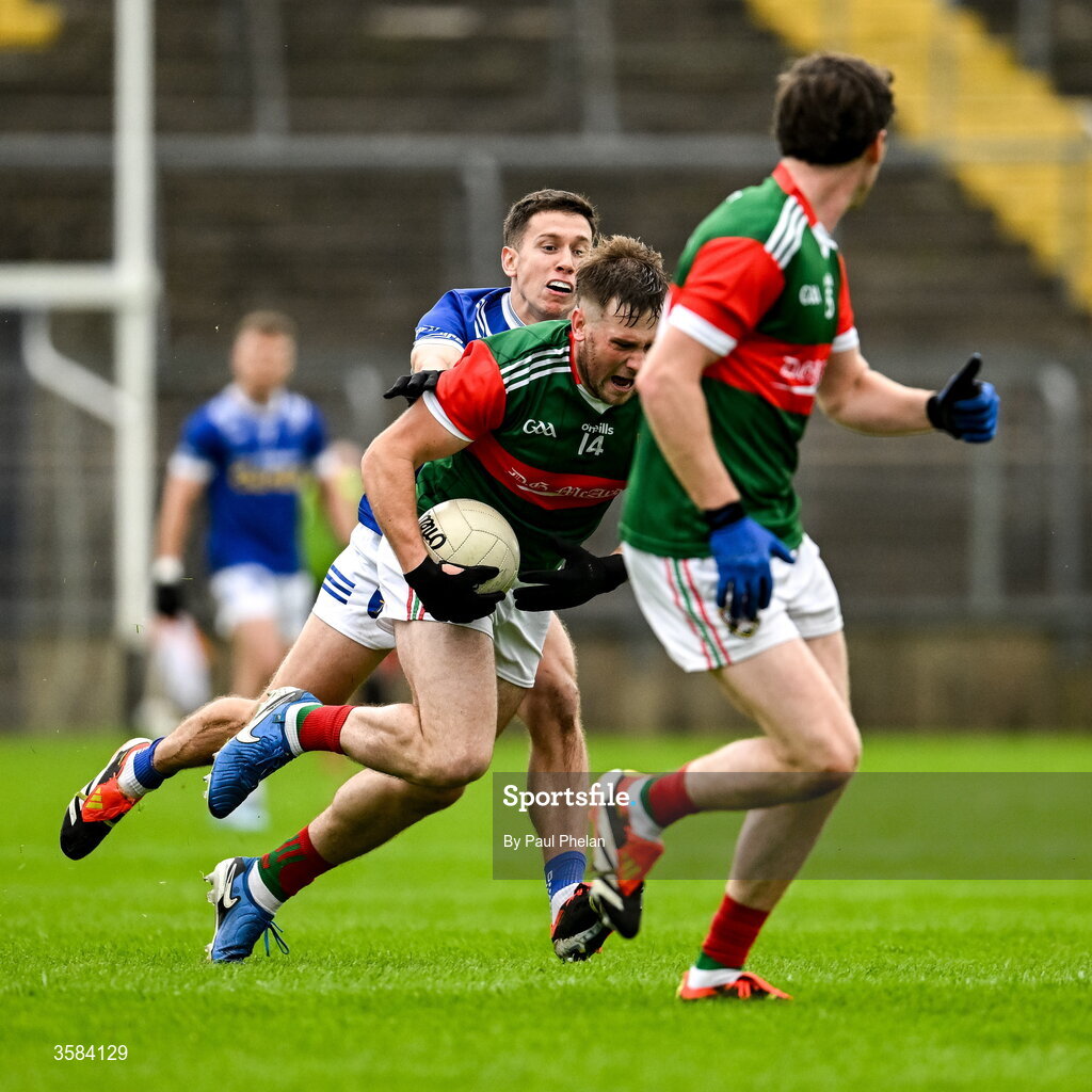 4 October 2026; Andrew Woods of Inniskeen is tackled by Francis Maguire of Scotstown during the Monaghan County Senior Club Football Championship semi-final match between Scotstown and Inniskeen at St Tiernach’s Park in Clones, Monaghan. Photo by Paul Phelan/Sportsfile