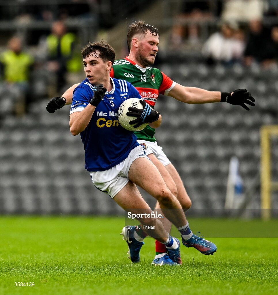 4 October 2026; Donnchadh Connolly of Scotstown is tripped by Andrew Woods of Inniskeen during the Monaghan County Senior Club Football Championship semi-final match between Scotstown and Inniskeen at St Tiernach’s Park in Clones, Monaghan. Photo by Paul Phelan/Sportsfile