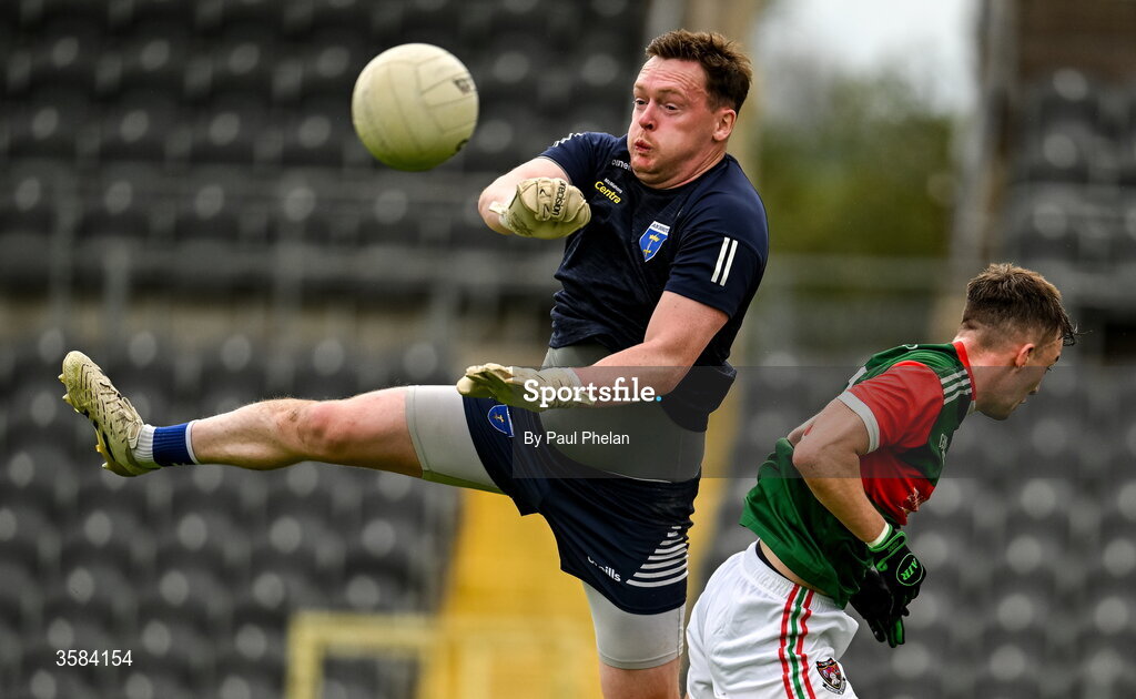 4 October 2026; Scotstown goalkeeper Rory Beggan punches the ball clear of Gareth Burns of Inniskeen during the Monaghan County Senior Club Football Championship semi-final match between Scotstown and Inniskeen at St Tiernach’s Park in Clones, Monaghan. Photo by Paul Phelan/Sportsfile