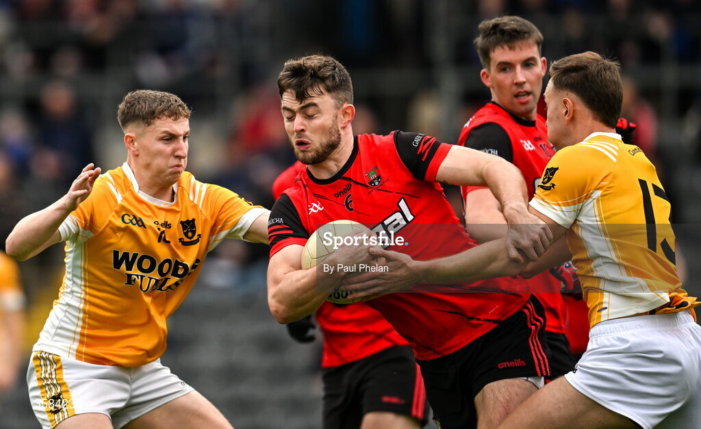 4 October 2026; Ryan Mohan of Gaeil Triucha CLG is tackled by Evan Treanor and Dean McDonnell of Clontibret O'Neills during the Monaghan County Senior Club Football Championship semi-final match between Clontibret O'Neills and Gaeil Triucha CLG at St Tiernach’s Park in Clones, Monaghan. Photo by Paul Phelan/Sportsfile