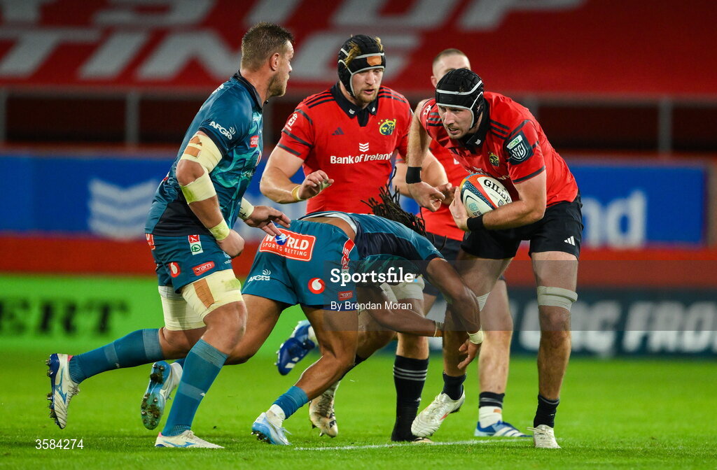 3 October 2026; Tom Ahern of Munster is tackled by Stedman Gans of Vodacome Bulls during the United Rugby Championship match between Munster and Vodacom Bulls at Thomond Park in Limerick. Photo by Brendan Moran/Sportsfile