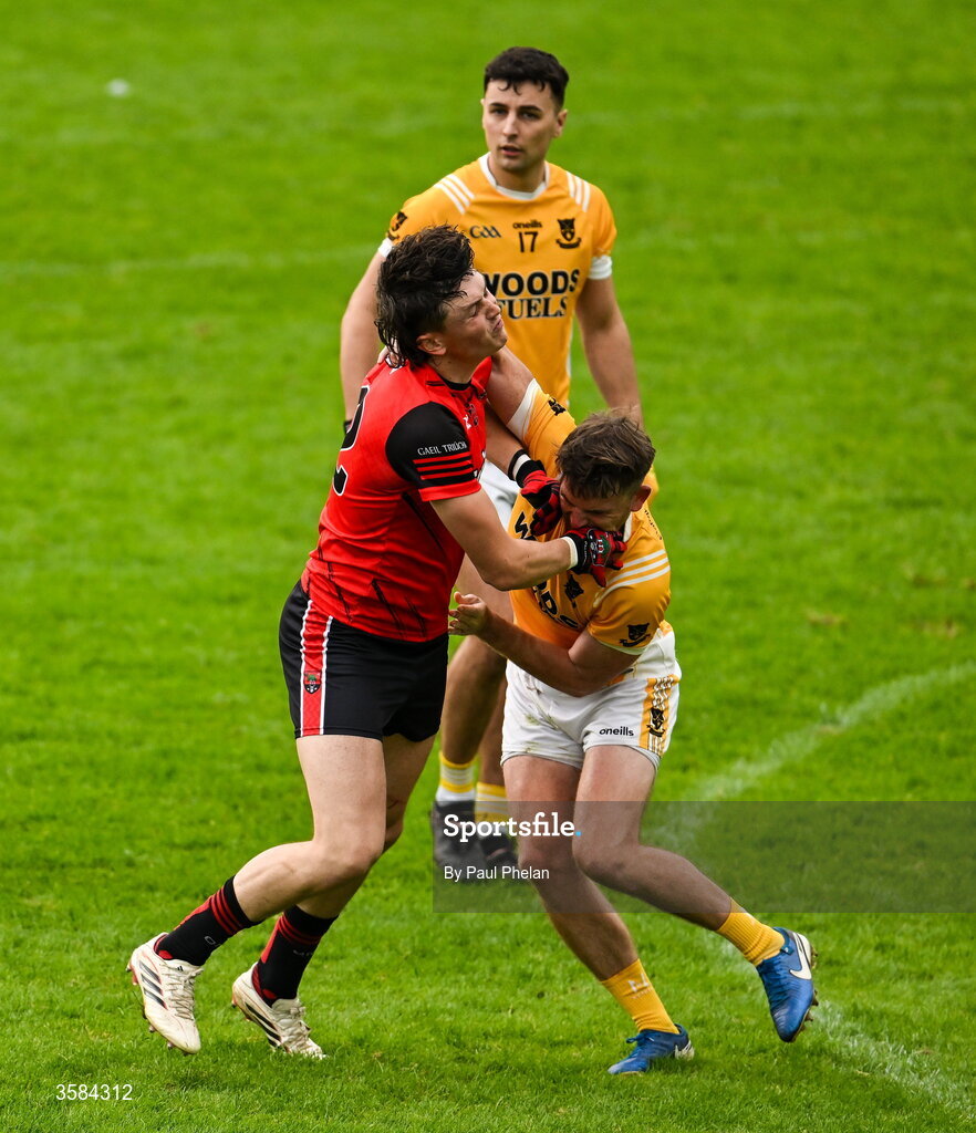 4 October 2026; Gary Mohan of Gaeil Triucha CLG and Dessie Mone of Clontibret O'Neills tussle during the Monaghan County Senior Club Football Championship semi-final match between Clontibret O'Neills and Gaeil Triucha CLG at St Tiernach’s Park in Clones, Monaghan. Photo by Paul Phelan/Sportsfile