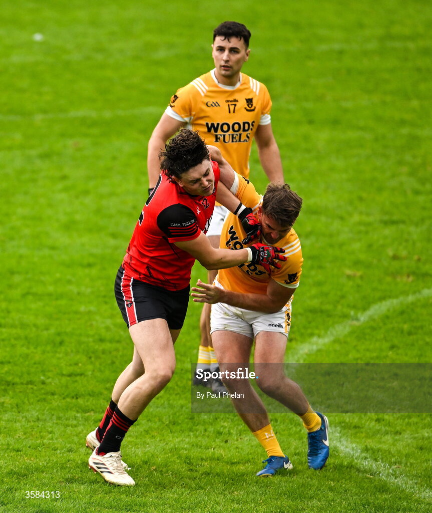 4 October 2026; Gary Mohan of Gaeil Triucha CLG and Dessie Mone of Clontibret O'Neills tussle during the Monaghan County Senior Club Football Championship semi-final match between Clontibret O'Neills and Gaeil Triucha CLG at St Tiernach’s Park in Clones, Monaghan. Photo by Paul Phelan/Sportsfile