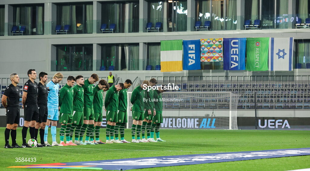 4 October 2026; The Republic of Ireland team, wearing black armbands in recognition for all the lives lost in the conflict in Gaza, bow their heads during the Israeli national anthem before the UEFA Nations League B match between the Republic of Ireland and Israel at TSC Arena in Backa Topola, Serbia. Photo by Luka Milosavljevic/Sportsfile