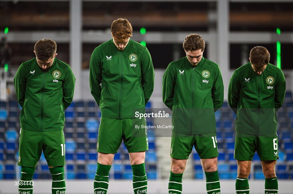 4 October 2026; Republic of Ireland players, from left, Ryan Manning, Jake O'Brien, Conor Coventry and Jayson Molumby, wearing black armbands in recognition for all the lives lost in the conflict in Gaza, bow their heads during the Israeli national anthem before the UEFA Nations League B match between the Republic of Ireland and Israel at TSC Arena in Backa Topola, Serbia. Photo by Stephen McCarthy/Sportsfile