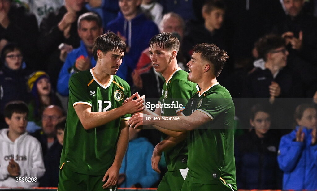 6 October 2026; Tommy Lonergan of Republic of Ireland, right, celebrates with team-mates Cathal McCarthy, left, and Oisin Gallagher after scoring their side's third goal during the UEFA European U21 Championship qualifier match between the Republic of Ireland and England at Turner's Cross Stadium in Cork. Photo by Ben McShane/Sportsfile