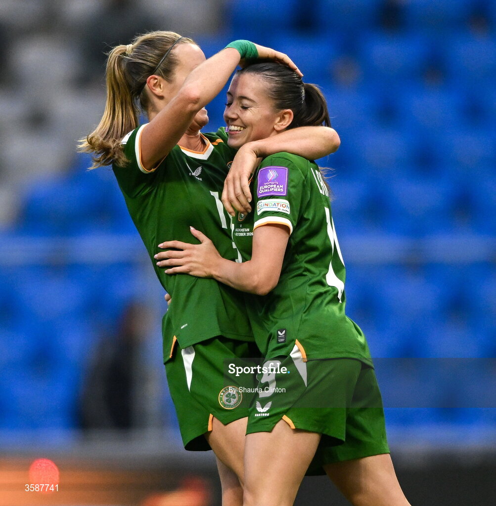 9 October 2026; Abbie Larkin of Republic of Ireland, right, celebrates with team-mate Kyra Carusa after scoring their side's fifth goal during the 2027 FIFA Women’s World Cup qualifying round 1 play-off first leg match between Kazakhstan and the Republic of Ireland at Astana Arena in Kazakhstan. Photo by Shauna Clinton/Sportsfile
