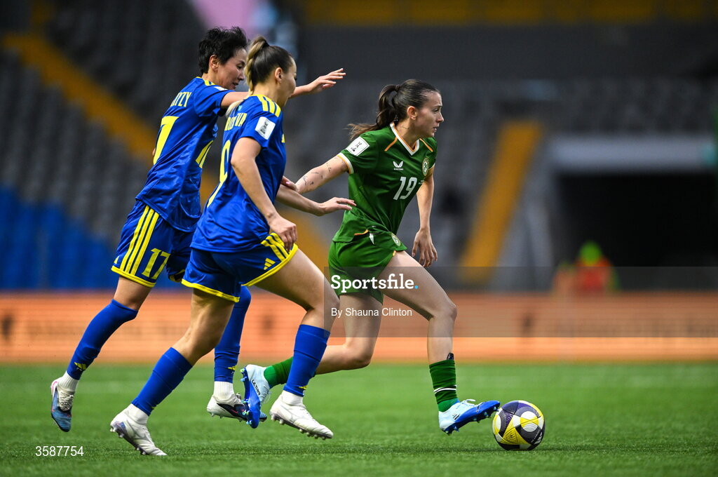 9 October 2026; Abbie Larkin of Republic of Ireland in action against Karina Zhumabaikyzy, left, and Aida Gaistenova of Kazakhstan during the 2027 FIFA Women’s World Cup qualifying round 1 play-off first leg match between Kazakhstan and the Republic of Ireland at Astana Arena in Kazakhstan. Photo by Shauna Clinton/Sportsfile