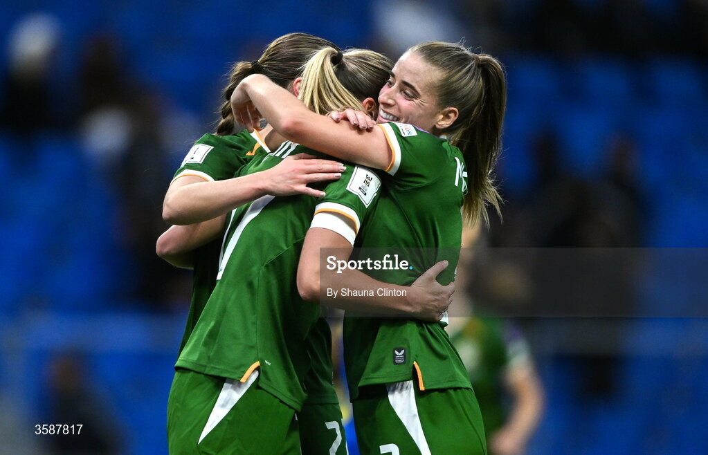 9 October 2026; Jamie Finn of Republic of Ireland, centre, celebrates with team-mate Chloe Mustaki, right, after scoring their side's sixth goal during the 2027 FIFA Women’s World Cup qualifying round 1 play-off first leg match between Kazakhstan and the Republic of Ireland at Astana Arena in Kazakhstan. Photo by Shauna Clinton/Sportsfile