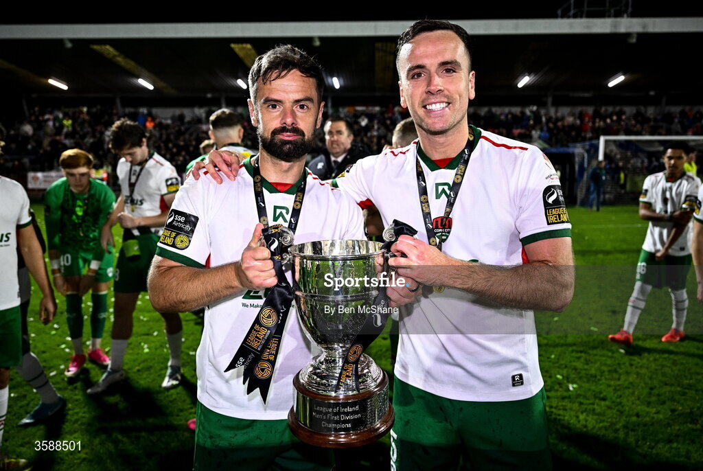 9 October 2026; Greg Bolger, left, and Charlie Lyons of Cork City celebrate with the SSE Airtricity Men’s First Division trophy after the SSE Airtricity Men’s First Division match between Cork City and Finn Harps at Turner's Cross in Cork. Photo by Ben McShane/Sportsfile