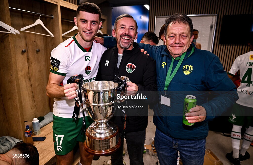 9 October 2026; Cork City owner Dermot Usher, centre, with Darragh Crowley, left, and Cork City groundsman Barry Moore celebrate with the SSE Airtricity Men’s First Division trophy after the SSE Airtricity Men’s First Division match between Cork City and Finn Harps at Turner's Cross in Cork. Photo by Ben McShane/Sportsfile
