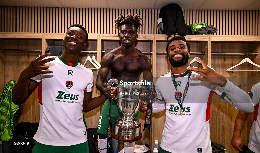 9 October 2026; Cork City players Denzell Obenge, Joe Aidoo, Hans Mpongo celebrate with the SSE Airtricity Men’s First Division trophy after the SSE Airtricity Men’s First Division match between Cork City and Finn Harps at Turner's Cross in Cork. Photo by Ben McShane/Sportsfile