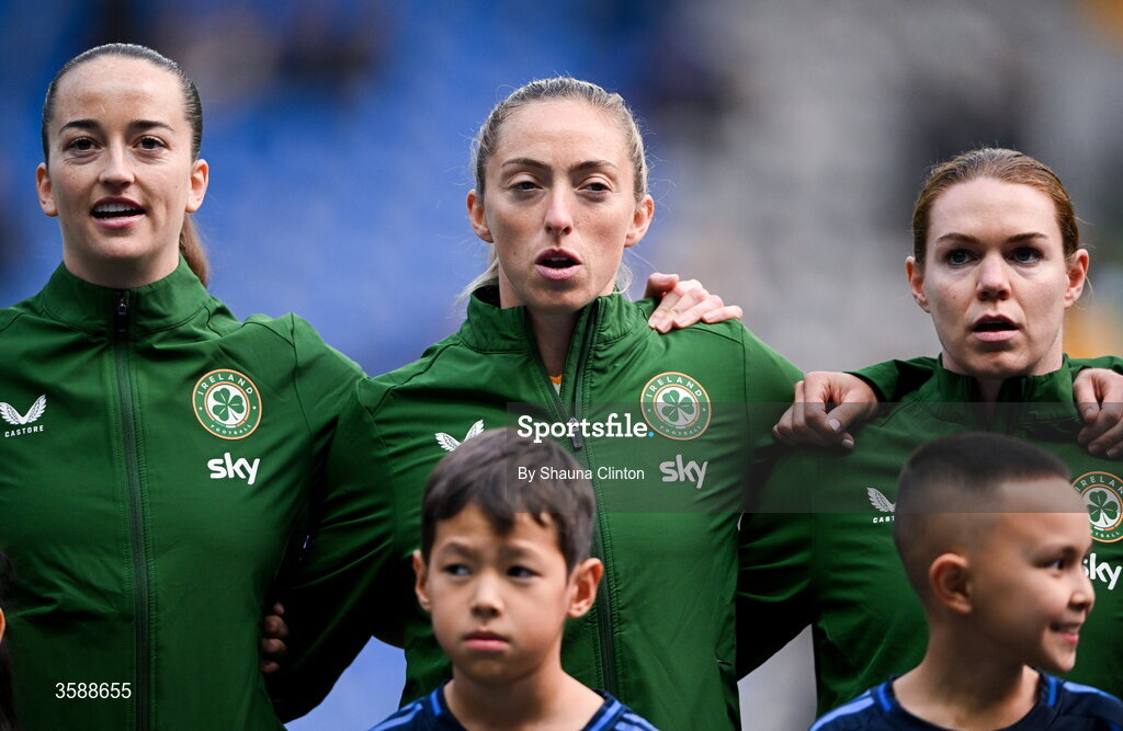 9 October 2026; Republic of Ireland players, from left, Anna Patten, Megan Connolly and Aoife Mannion stand for the playing of the national anthem before the 2027 FIFA Women’s World Cup qualifying round 1 play-off first leg match between Kazakhstan and the Republic of Ireland at Astana Arena in Kazakhstan. Photo by Shauna Clinton/Sportsfile