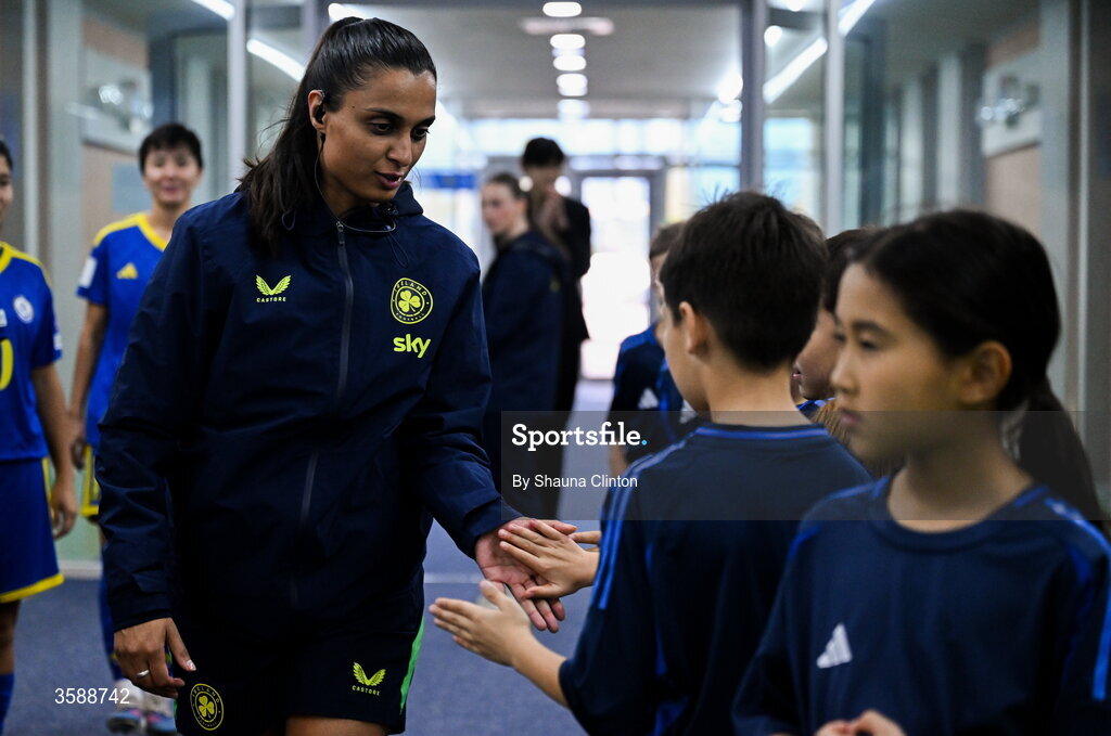 9 October 2026; Republic of Ireland performance analyst Jasmine Mander with mascots before the 2027 FIFA Women’s World Cup qualifying round 1 play-off first leg match between Kazakhstan and the Republic of Ireland at Astana Arena in Kazakhstan. Photo by Shauna Clinton/Sportsfile
