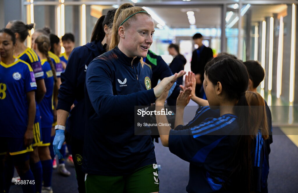 9 October 2026; Amber Barrett of Republic of Ireland with mascots before the 2027 FIFA Women’s World Cup qualifying round 1 play-off first leg match between Kazakhstan and the Republic of Ireland at Astana Arena in Kazakhstan. Photo by Shauna Clinton/Sportsfile