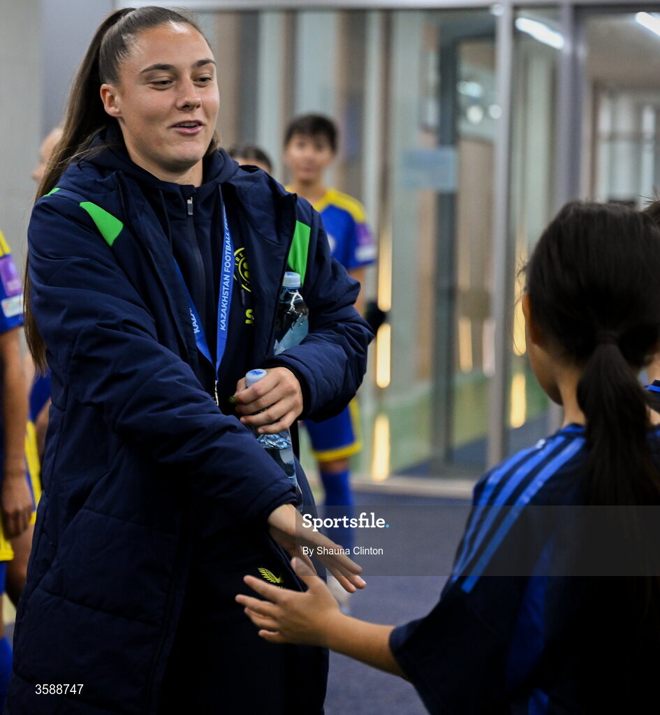 9 October 2026; Jess Ziu of Republic of Ireland with mascots before the 2027 FIFA Women’s World Cup qualifying round 1 play-off first leg match between Kazakhstan and the Republic of Ireland at Astana Arena in Kazakhstan. Photo by Shauna Clinton/Sportsfile