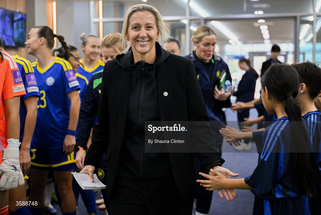 9 October 2026; Republic of Ireland head coach Carla Ward with mascots before the 2027 FIFA Women’s World Cup qualifying round 1 play-off first leg match between Kazakhstan and the Republic of Ireland at Astana Arena in Kazakhstan. Photo by Shauna Clinton/Sportsfile