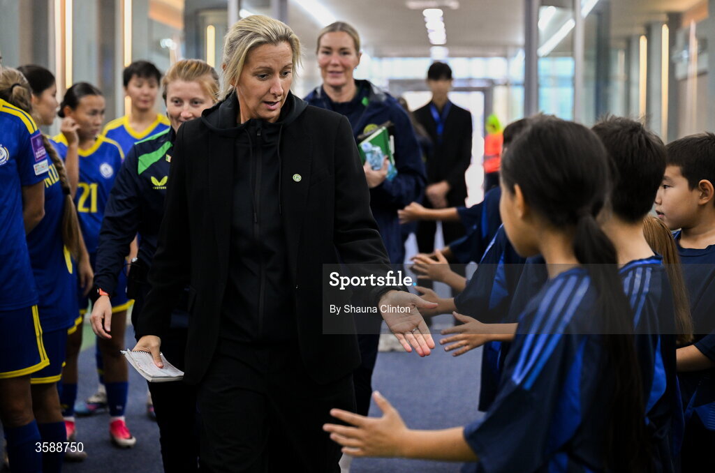 9 October 2026; Republic of Ireland head coach Carla Ward with mascots before the 2027 FIFA Women’s World Cup qualifying round 1 play-off first leg match between Kazakhstan and the Republic of Ireland at Astana Arena in Kazakhstan. Photo by Shauna Clinton/Sportsfile