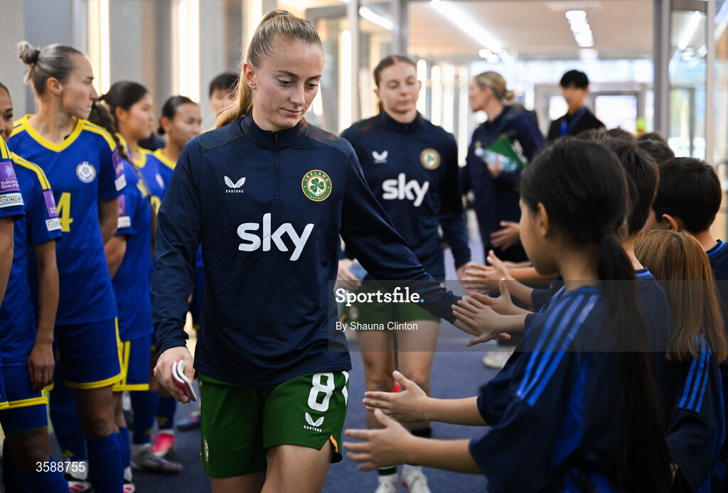 9 October 2026; Aoibheann Clancy of Republic of Ireland with mascots before the 2027 FIFA Women’s World Cup qualifying round 1 play-off first leg match between Kazakhstan and the Republic of Ireland at Astana Arena in Kazakhstan. Photo by Shauna Clinton/Sportsfile