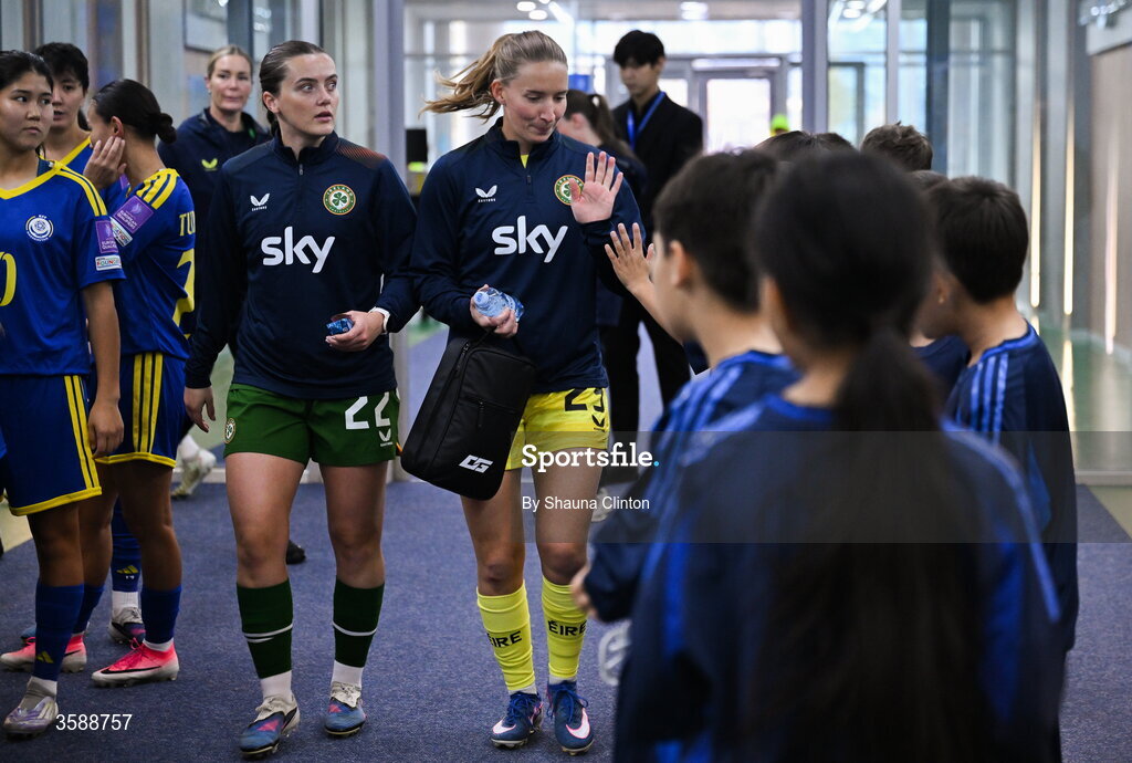 9 October 2026; Republic of Ireland players Tyler Toland, left, and Sophie Whitehouse with mascots before the 2027 FIFA Women’s World Cup qualifying round 1 play-off first leg match between Kazakhstan and the Republic of Ireland at Astana Arena in Kazakhstan. Photo by Shauna Clinton/Sportsfile