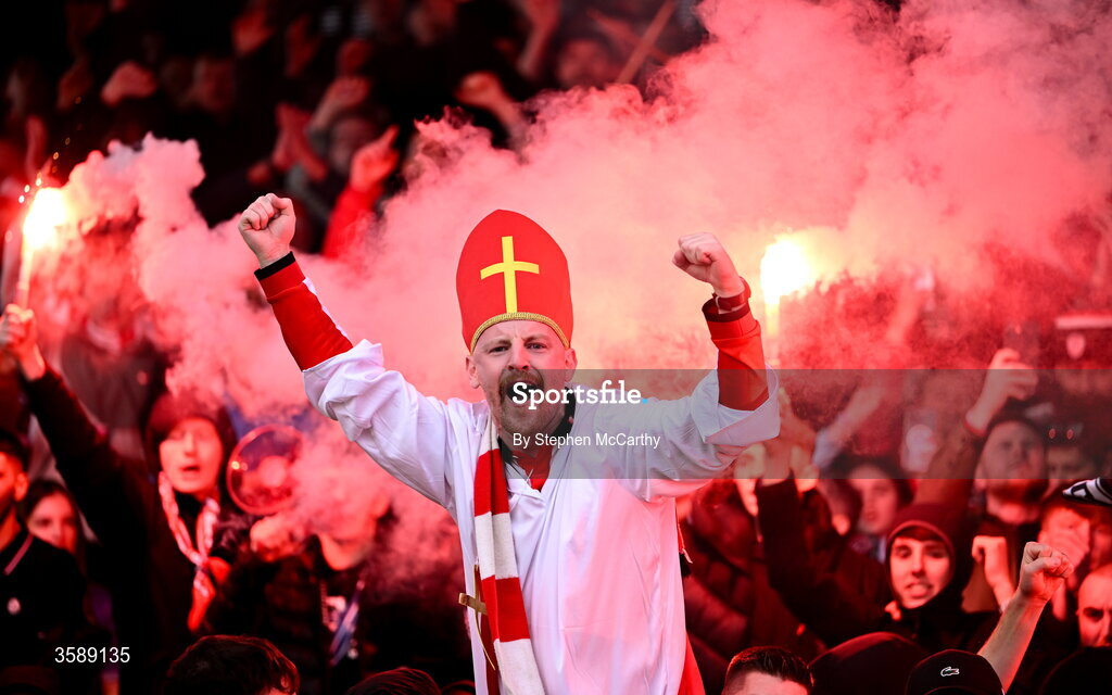 10 October 2026; A Derry City supporter celebrates following the Club Orange Men's FAI Cup semi-final match between Galway and Derry City at Eamonn Deacy Park in Galway. Photo by Stephen McCarthy/Sportsfile