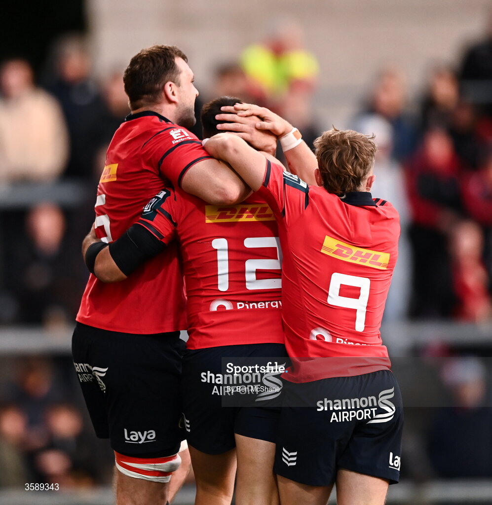 10 October 2026; Dan Kelly of Munster, 12, celebrates with teammates Tadhg Beirne, left, and Craig Casey after scoring their side's third try during the United Rugby Championship match between Ulster and Munster at Affidea Stadium in Belfast. Photo by Ben McShane/Sportsfile