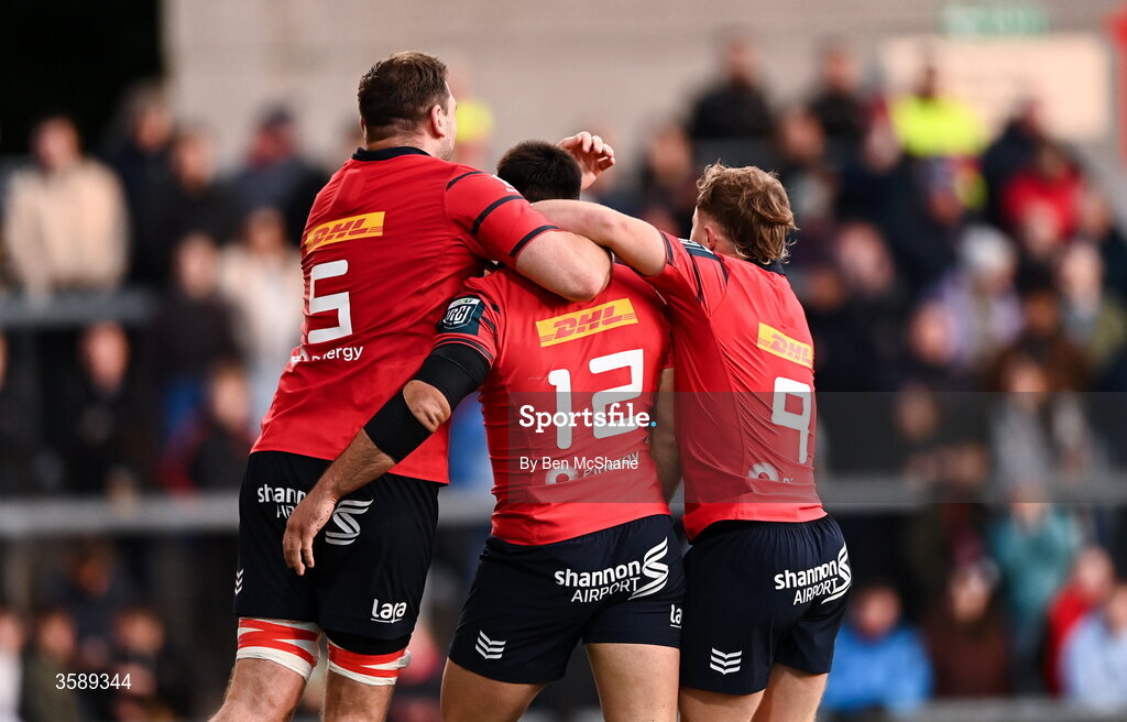 10 October 2026; Dan Kelly of Munster, 12, celebrates with teammates Tadhg Beirne, left, and Craig Casey after scoring their side's third try during the United Rugby Championship match between Ulster and Munster at Affidea Stadium in Belfast. Photo by Ben McShane/Sportsfile