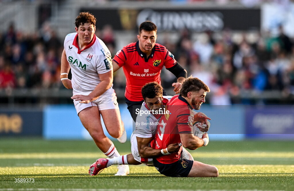 10 October 2026; Alex Nankivell of Munster is tackled by Rob Baloucoune of Ulster during the United Rugby Championship match between Ulster and Munster at Affidea Stadium in Belfast. Photo by Ben McShane/Sportsfile