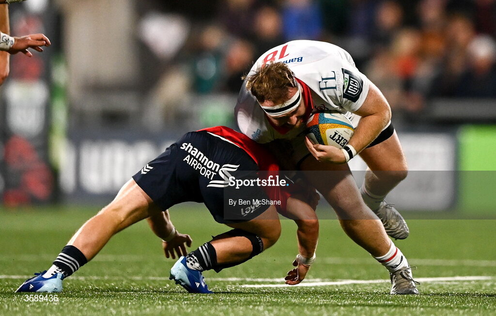 10 October 2026; Tom McAllister of Ulster is tackled by Craig Casey of Munster during the United Rugby Championship match between Ulster and Munster at Affidea Stadium in Belfast. Photo by Ben McShane/Sportsfile
