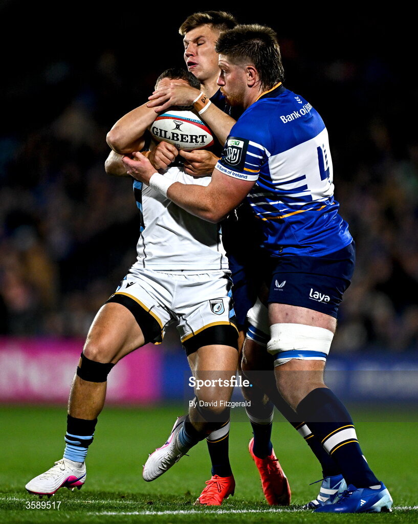 10 October 2026; Harri Millard of Cardiff is tackled by Sam Prendergast, left, and Joe McCarthy of Leinster during the United Rugby Championship match between Leinster and Cardiff at the Laya Arena in Dublin. Photo by David Fitzgerald/Sportsfile