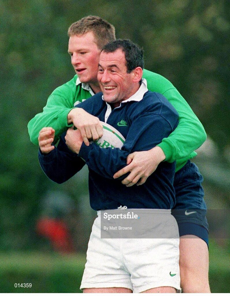 27 October 1998: Ireland's Eric Elwood is tackled by team-mate Malcolm O'Kelly, behind, during squad training. Ireland Rugby Squad Training, King's Hospital Rugby Ground, Dublin. Picture credit: Matt Browne / SPORTSFILE
