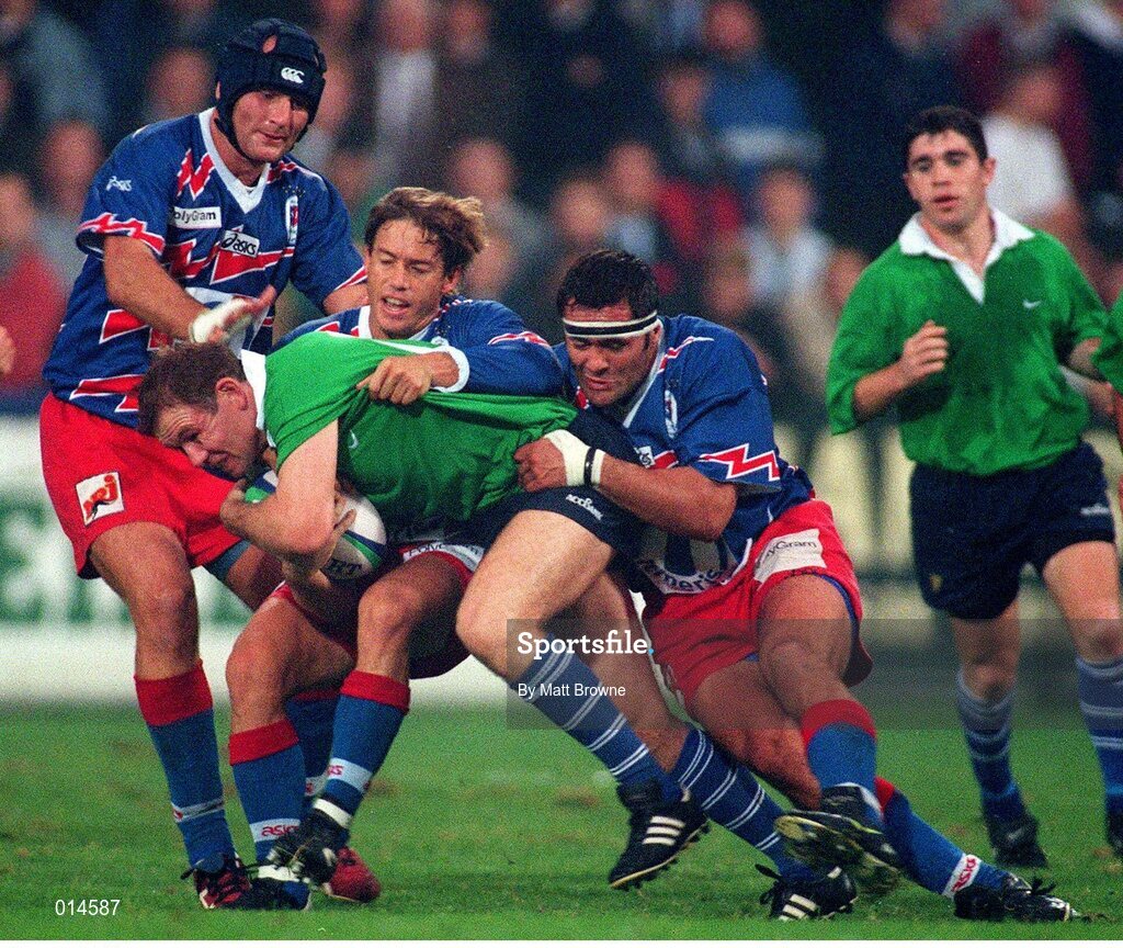 25 September1998; Leinster's Martin Ridge is tackled by Christopher Moni, left, Diego Dominguez, centre, and David Aurabou, Stade Francais. European Rugby Cup, Leinster v Stade Francais, Donnybrook, Dublin. Picture credit: Matt Browne / SPORTSFILE