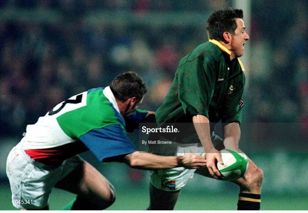 24 November 1998; Robbie Fleck, South Africa is tackled by Killian Keane, Combined Provinces. Rugby fiendly, Combined Provinces v South Africa, Musgrave Park, Cork. Picture credit: Matt Browne / SPORTSFILE