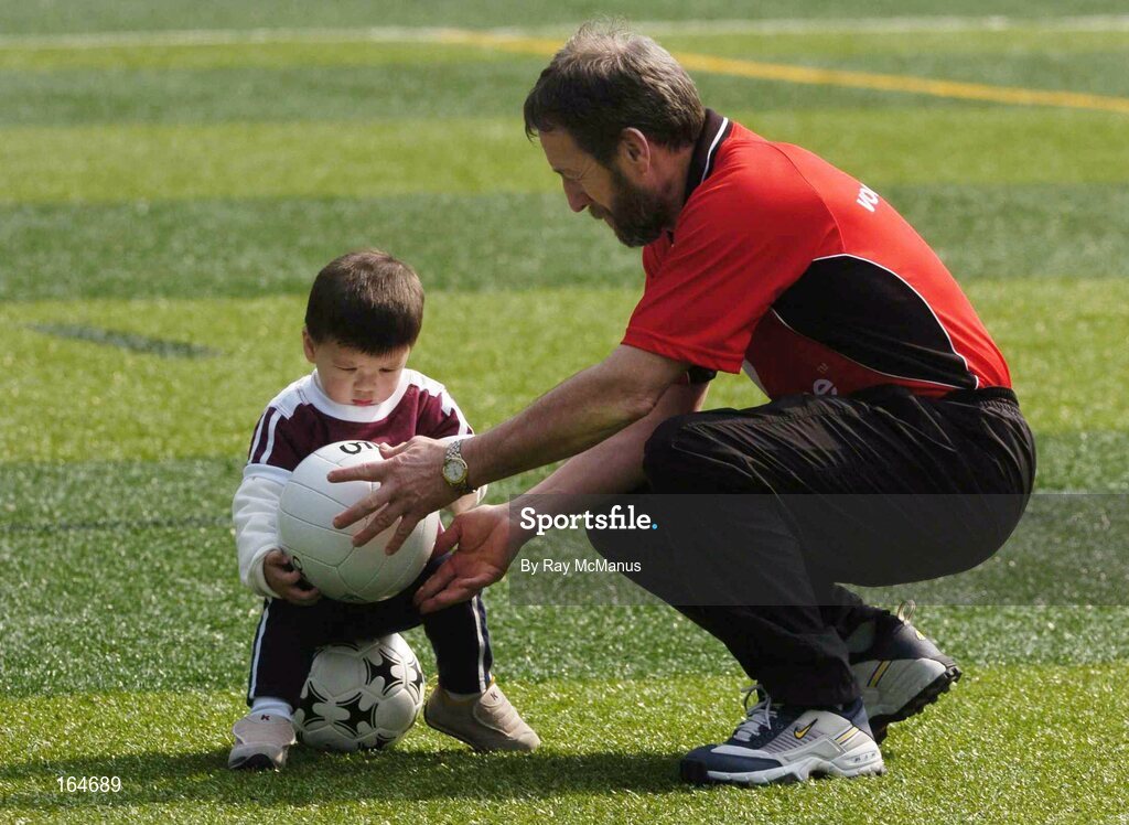 21 January 2005; Twenty month old Ciaran Delaney, from Hong Kong, with GAA President Sean Kelly before team training in advance of the 2004 Vodafone All-Stars Exhibition Game, 2003 Vodafone All-Stars v 2004 Vodafone All-Stars, Hong Kong Football Club, Hong Kong. Picture credit; Ray McManus / SPORTSFILE