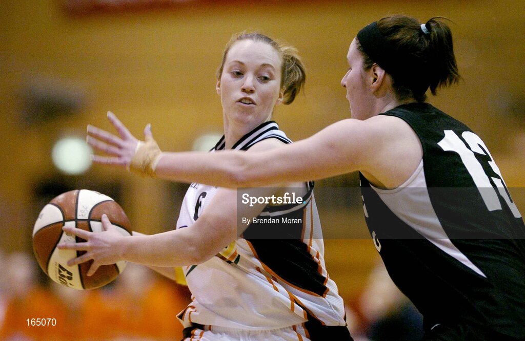 28 January 2005; Ciara Fenton, Dart Killester, in action against Muriossa Galwey, Mustang Sally's St Paul's. National Cup, Senior Women's Semi-Final, Mustang Sally's St. Paul's, Killarney v Dart Killester, ESB Arena, Tallaght, Dublin. Picture credit; Brendan Moran / SPORTSFILE