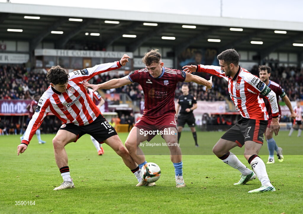 10 October 2026; Ed McCarthy of Galway United in action against James Clarke, left, and Michael Duffy of Derry City during the Club Orange Men's FAI Cup semi-final match between Galway and Derry City at Eamonn Deacy Park in Galway. Photo by Stephen McCarthy/Sportsfile
