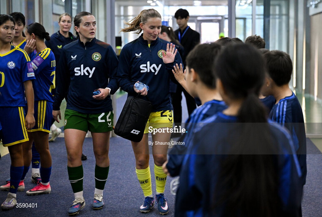 9 October 2026; Republic of Ireland players Tyler Toland, left, and Sophie Whitehouse with mascots before the 2027 FIFA Women’s World Cup qualifying round 1 play-off first leg match between Kazakhstan and the Republic of Ireland at Astana Arena in Kazakhstan. Photo by Shauna Clinton/Sportsfile